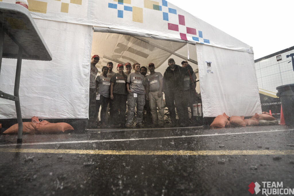 Team Rubicon members were greeted by heavy rain and lighting storms just before setting out to their worksites.