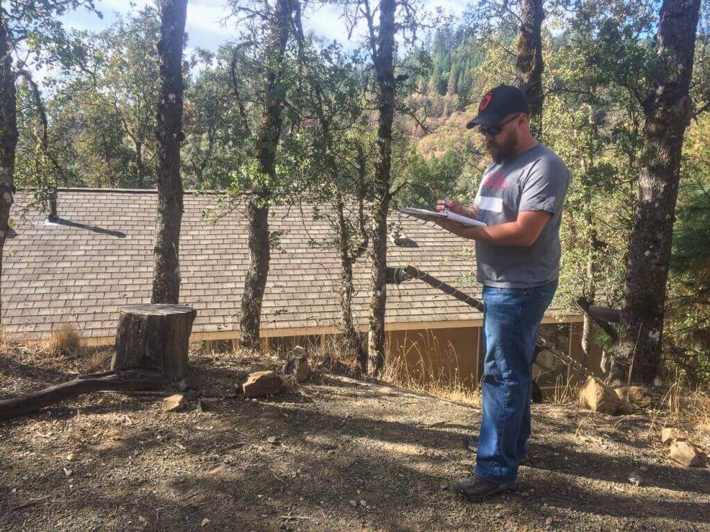 Army veteran Jason Keller logs damage assessments during Operation: Mountain Woman in Lake County, CA. 