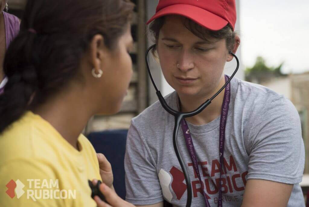 Team Rubicon UK member Emma Butterfield provides a health assessment on a young girl in Bahia, Ecuador. Team Rubicon volunteers are currently conducting disaster and medical assessment in Ecuador after an earthquake recently caused devastation in the country.