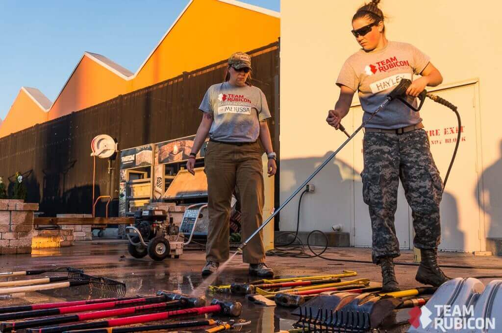 Army veterans Merissa Morgan (left) and Hayley Albers (right) tackle some end-of-day decon in Glenn Heights, TX. 
