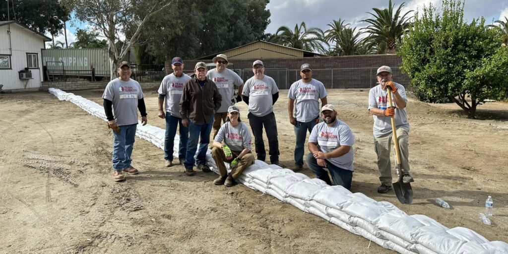 volunteers with sandbags