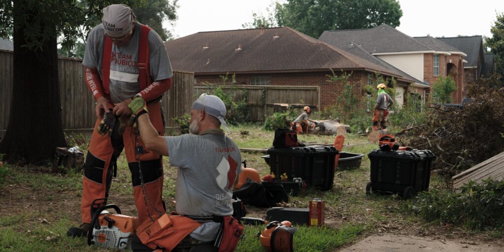 Sawyers work at a Texas home damaged in the May tornadoes.